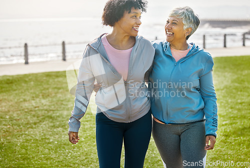 Image of Hug, fitness and senior friends in nature for morning walking, quality time and retirement in park. Smile, talking and elderly women with care, love and together on field by promenade for laughing