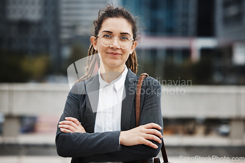 Image of Business woman, professional portrait and arms crossed outdoor with a career and creative job pride. City, entrepreneur and work commute in morning with female person from New York in urban town