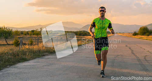 Image of Triathlete in professional gear running early in the morning, preparing for a marathon, dedication to sport and readiness to take on the challenges of a marathon.