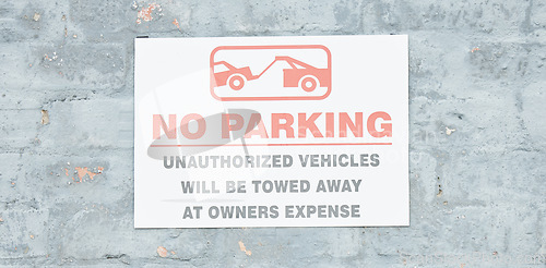 Image of Warning, parking and stop with sign and towing icon on wall for forbidden, security and no. Transportation, prohibited and emergency with board for safety, private property and restriction banner