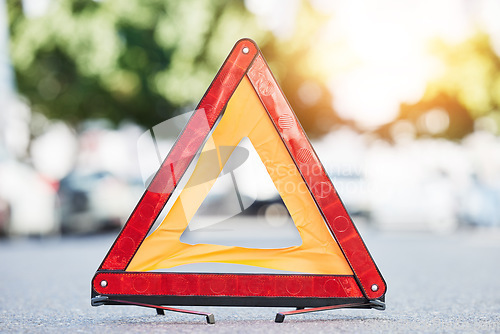 Image of Red triangle, road sign and stop for emergency, construction or symbol for caution to driver on the ground, floor or street. Attention, warning and signal to traffic of an accident or problem