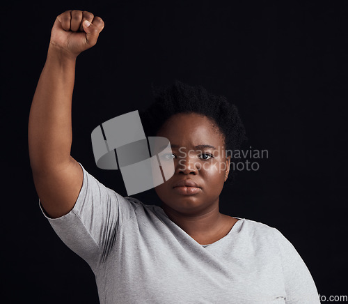 Image of Portrait, serious and black woman on a studio background for a protest, justice or social freedom. Riot, fight and an African girl ready for government change, conflict or a revolution on a backdrop