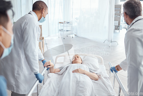 Image of Doctors, theater and push woman in bed for emergency surgery for cancer treatment. Medical professional, team or surgeon rush patient to operation, er or hospital clinic to save a life for healthcare