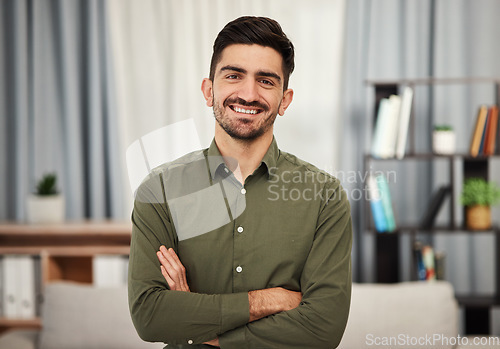 Image of Portrait, consultant and man with arms crossed in home for remote work. Face, business professional and confident entrepreneur from Spain with smile, happy and positive mindset for freelance career