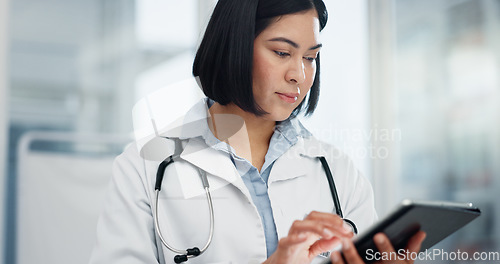 Image of Woman, doctor and tablet for healthcare search, typing and clinic or hospital software, telehealth or research. Office, online charts or report of medical professional or asian person on digital tech