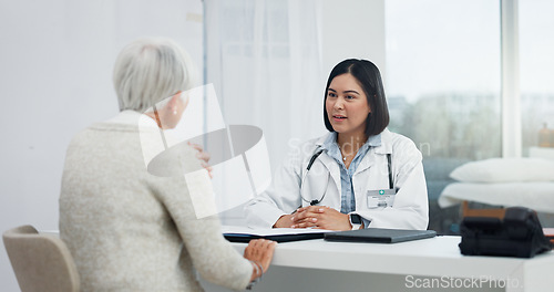 Image of Healthcare, talking and a doctor with a senior woman, shoulder pain problem and support in an office. Hospital, consulting and a female nurse speaking to an elderly patient about medical advice