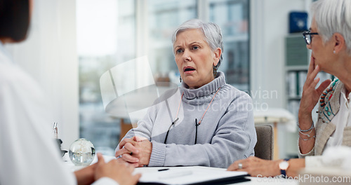Image of Healthcare, cancer or bad news with a senior woman and friend talking to a doctor in the hospital. Medical, support and diagnosis with a medicine professional consulting a patient in the clinic