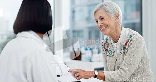 Image of Senior woman, doctor and happy for results at consultation with paperwork, report or progress for healthcare. Medic, elderly patient and checklist in office for trust, health and advice at hospital