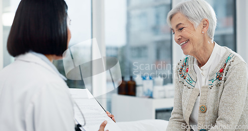 Image of Senior woman, doctor and happy for results at consultation with paperwork, report or progress for healthcare. Medic, elderly patient and checklist in office for trust, health and advice at hospital