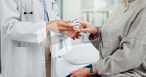 Image of Healthcare, hands and a doctor with a patient and oximeter to check oxygen in the blood in a consultation. Hospital, help and a medical worker with gear and a person for health results at a clinic