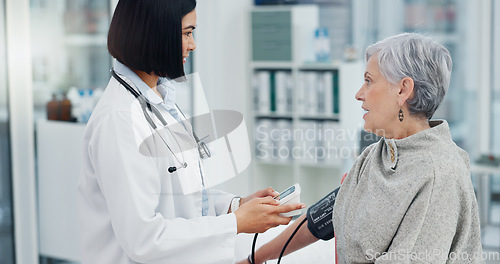 Image of Senior woman, blood pressure and doctor for healthcare service, hospital office support and clinic monitor. Diabetes, hypertension test and elderly patient with medical professional advice or helping