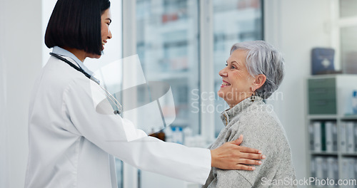 Image of Senior support, talking and woman with a doctor for healthcare advice, consultation and results. Smile, hospital and an elderly patient with a clinic worker and care for a surgery discussion