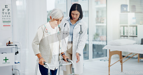 Image of Support, doctor and senior woman in walking frame for healthcare service, muscle health or rehabilitation. Nurse, medical physiotherapy of elderly patient with disability, Parkinson or clinic helping