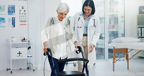 Image of Old woman, doctor and physiotherapy with walking frame for support, help and healthcare. Senior, medical professional and person with a disability in hospital, rehabilitation and physical therapy.
