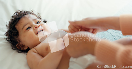 Image of Care, happy and mother with baby on bed for playful, love and free time. Happiness, smile and health with woman and newborn infant in bedroom for family home for support, excited and youth