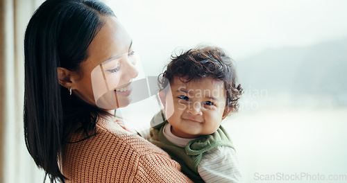 Image of Mother, newborn and smile by window, home and happy together with care, love and bonding in childhood. Mom, infant baby and excited with connection, development and hug at family house in Canada