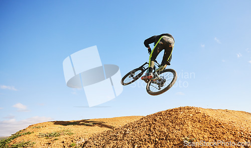 Image of Bicycle, man and jump in air, dirt and outdoor for sports, race or adventure in summer, woods or nature. Extreme cycling, person and freedom for trail, mockup space or challenge for fitness in forest