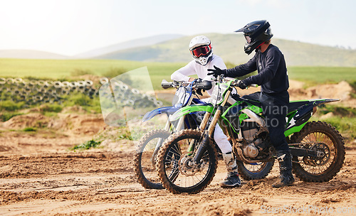 Image of Sports, friends and men with motorcycle in countryside for fun, hobby and stunt training, practice or freedom. Off road on dirt, motorbike and biker people in nature for adrenaline, challenge or race