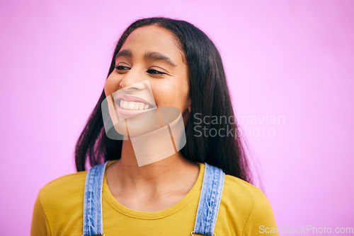 Image of Smile, woman and happy in studio with confidence, gen z style and youth fashion. Pink background, female person and girl from India feeling proud and excited with modern, trendy and student clothing