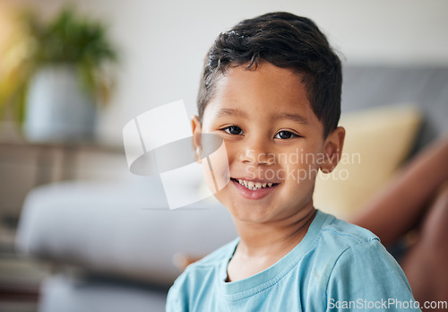 Image of Kid, smile portrait and happy in family home in the morning feeling relax in living room. Face, kids and house with a young child, boy and cute son from Peru on the weekend with joy and youth