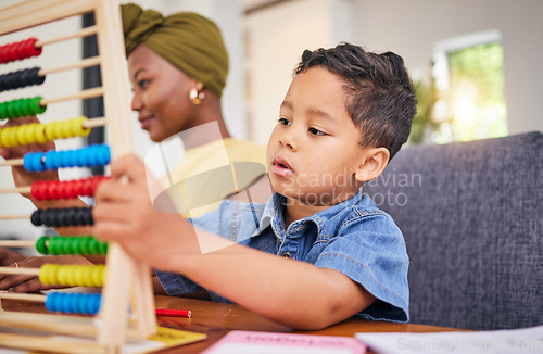 Image of Child, homework and math in home with counting on abacus for development growth. Young boy, student and school work for education and learning at a house with kindergarten tools for youth study