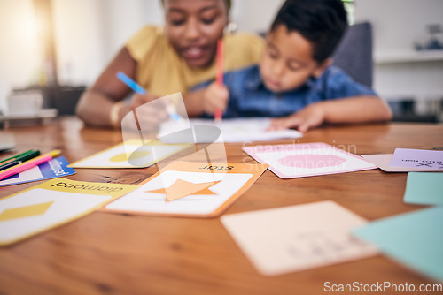 Image of Child, homework help and study card in home with shapes teaching for development growth. Young boy, mom support and school work for education and coloring at a house for kindergarten at the table