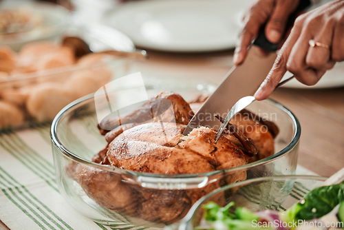 Image of Hands, cutting turkey and thanksgiving in closeup, lunch or food for event, celebration and nutrition. Person, cutlery and chicken food for eating, share and culture for diet, zoom or dinner in home