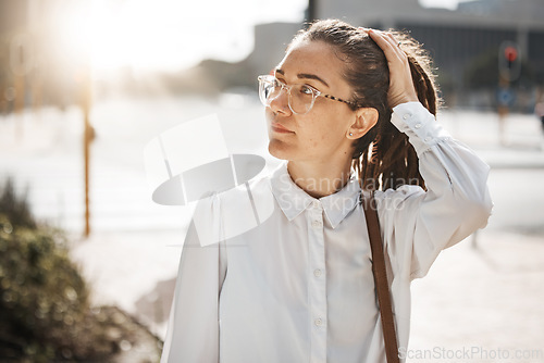 Image of City, thinking and business woman on a sidewalk with travel, commute and urban journey. Road, outdoor and female professional in the morning traveling for work, career and job in New York on street