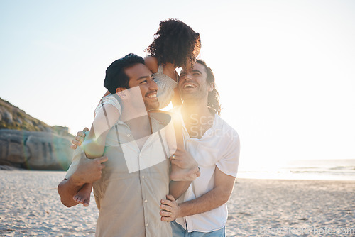 Image of LGBT, beach child and family laughing at conversation joke, holiday humour or enjoy funny time together in Canada. Love bond, nature comedy or gay parents walking with adoption kid on dads shoulders