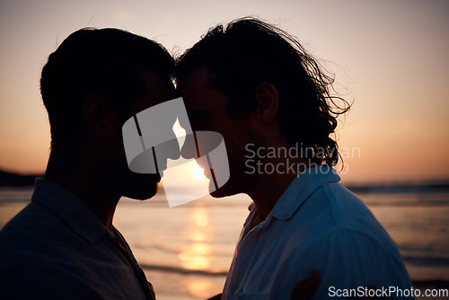 Image of Beach, sunset and gay couple in silhouette, embrace and love on summer island vacation together in Thailand. Sun, ocean and romance, lgbt men in nature and relax on holiday with pride, sea and light.