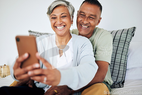 Image of Mature, happy couple and selfie in bed at home with smile, retirement and marriage. House, mobile and social media for profile picture in bedroom with online and photo on web with senior people