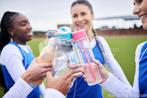 Image of Sports women group, grass and bottle in circle for toast, celebration and diversity with team building, Girl friends, cheers and success with winning, goal and outdoor for training, wellness or water