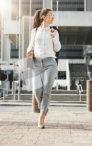 Image of City, walking and business woman on a sidewalk with travel, commute and urban journey. Road, outdoor and female professional in the morning traveling for work, career and job in New York on street