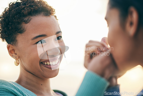 Image of Lesbian, holding hands or gay couple kiss with love or pride in LGBTQ community with smile or support. Friends, women or happy people in nature on a romantic date or commitment on holiday vacation