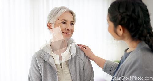 Image of Consultation, physical therapy and senior woman with a nurse in a medical clinic or rehabilitation center. Healthcare, wellness and elderly female patient talking to a physiotherapist at a checkup.