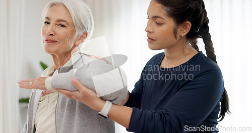 Image of Physiotherapy, arm stretching and senior woman assessment, test or body exam for chiropractic rehabilitation. Physical therapy, chiropractor injury healing or physiotherapist helping elderly patient