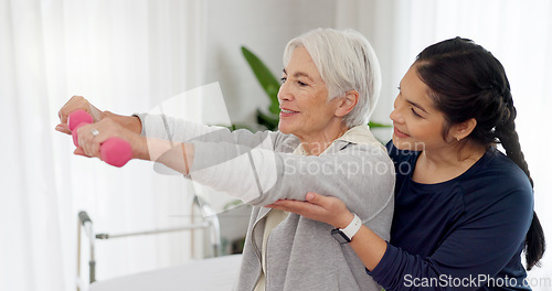 Image of Woman, nurse and dumbbell with senior patient in physiotherapy, exercise or workout at old age home. Female doctor caregiver or personal trainer helping in elderly care, weightlifting or healthy body