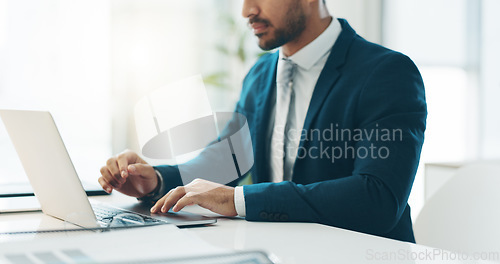 Image of Business man, suit and typing on laptop for network update, corporate insight and review in law firm. Closeup of lawyer, attorney and working on computer for legal research, planning admin and email