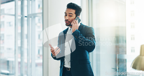 Image of Business, asian man and phone call communication in office for feedback, negotiation and trading on mobile. Broker, corporate agent and talking on smartphone for contact, consulting and conversation