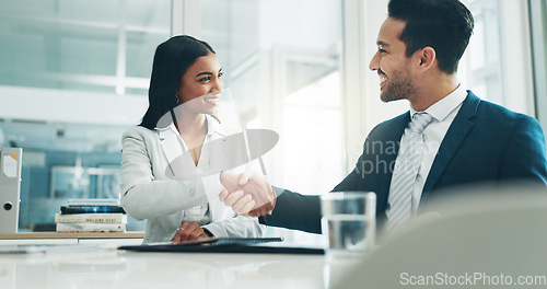 Image of Businessman, woman and signature with handshake for contract, hiring or legal agreement on document at office. Asian man shaking hands with female person for partnership or recruiting at workplace