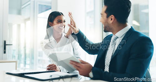 Image of Tablet, high five and success with business people in an office as a winner team for a career growth. Technology, partnership or promotion with a man and woman employee in celebration of a bonus