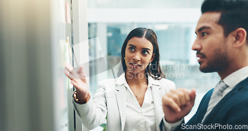 Image of Business people, teamwork and brainstorming on glass in office for agenda, collaboration and planning ideas. Man, woman and employees at board for feedback of schedule, mindmap and timeline of goals