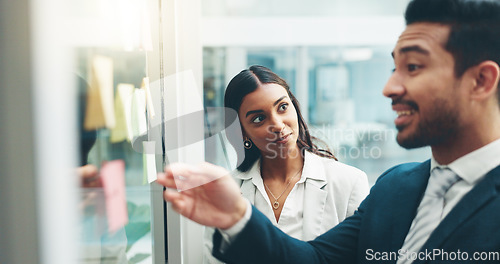 Image of Business people, teamwork and brainstorming on glass in office for agenda, collaboration and planning ideas. Man, woman and employees at board for feedback of schedule, mindmap and timeline of goals