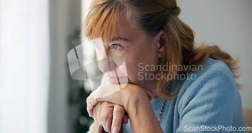 Image of Depression, sad and senior woman at home with mourning and memory with mental health problem. Elderly female person, sorry and anxiety in a house disappointed in retirement with grief and fail