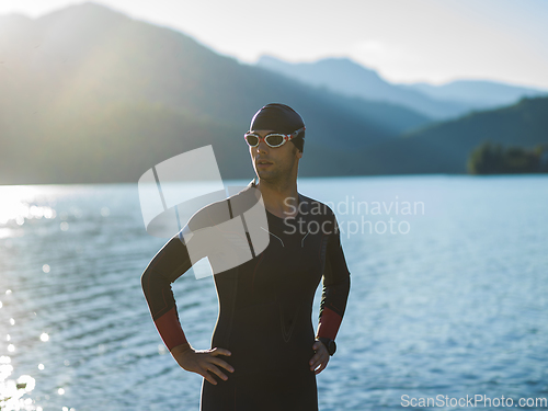 Image of A triathlon swimmer preparing for a river training to gear up for a marathon