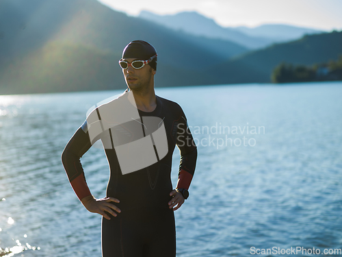 Image of A triathlon swimmer preparing for a river training to gear up for a marathon