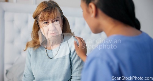 Image of Comfort, conversation and nurse with a senior woman after a cancer diagnosis in retirement home. Healthcare, consultation and elderly female patient listening to doctor at medical checkup in bedroom.