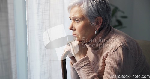 Image of Thinking, medical and window with old woman and walking stick in bedroom for wellness, retirement and healthcare. Depression, mental health and nursing home with patient with a disability for support