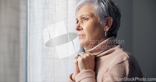 Image of Depression, sad and senior woman in home with mourning and memory with mental health problem. Elderly female person, sorry and anxiety in house feeling disappointed in retirement with grief and fail