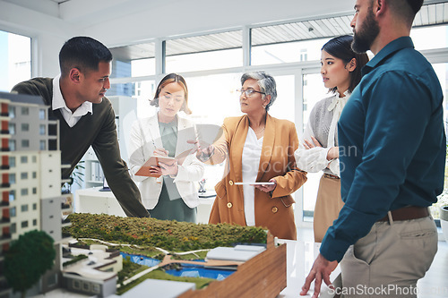 Image of Creative people, real estate and meeting with 3D model, building project or team startup at office. Group in teamwork discussion for architecture, brainstorming or planning strategy at the workplace